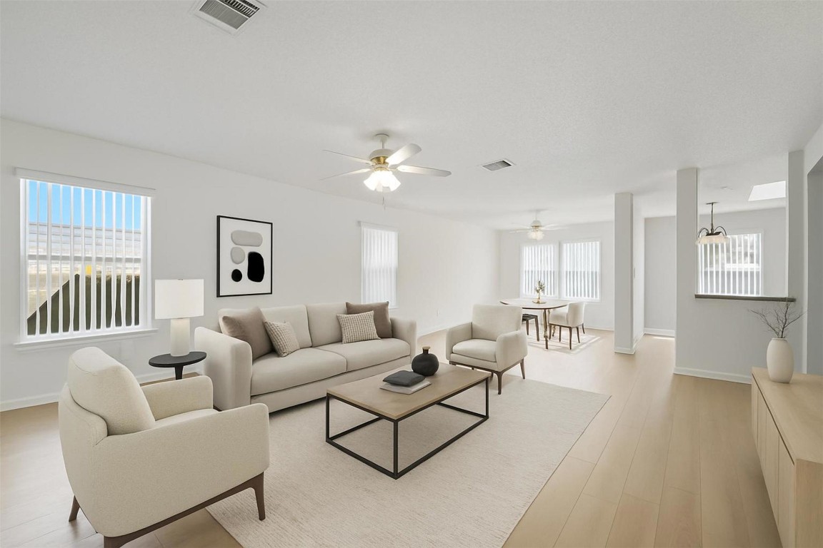 1312 Rosie Lane Cedar Park, TX 78613 - Photo 4 of 38 a living room with furniture and a table