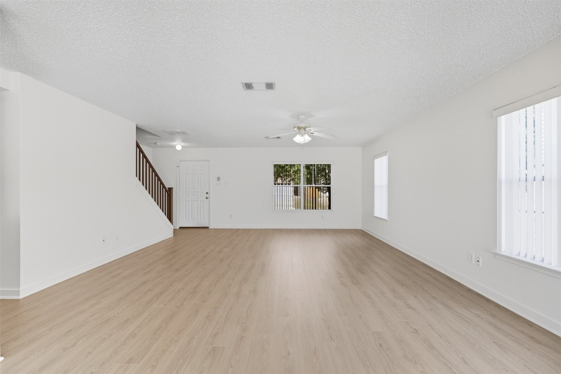1312 Rosie Lane Cedar Park, TX 78613 - Photo 8 of 38 an empty room with windows and entrance