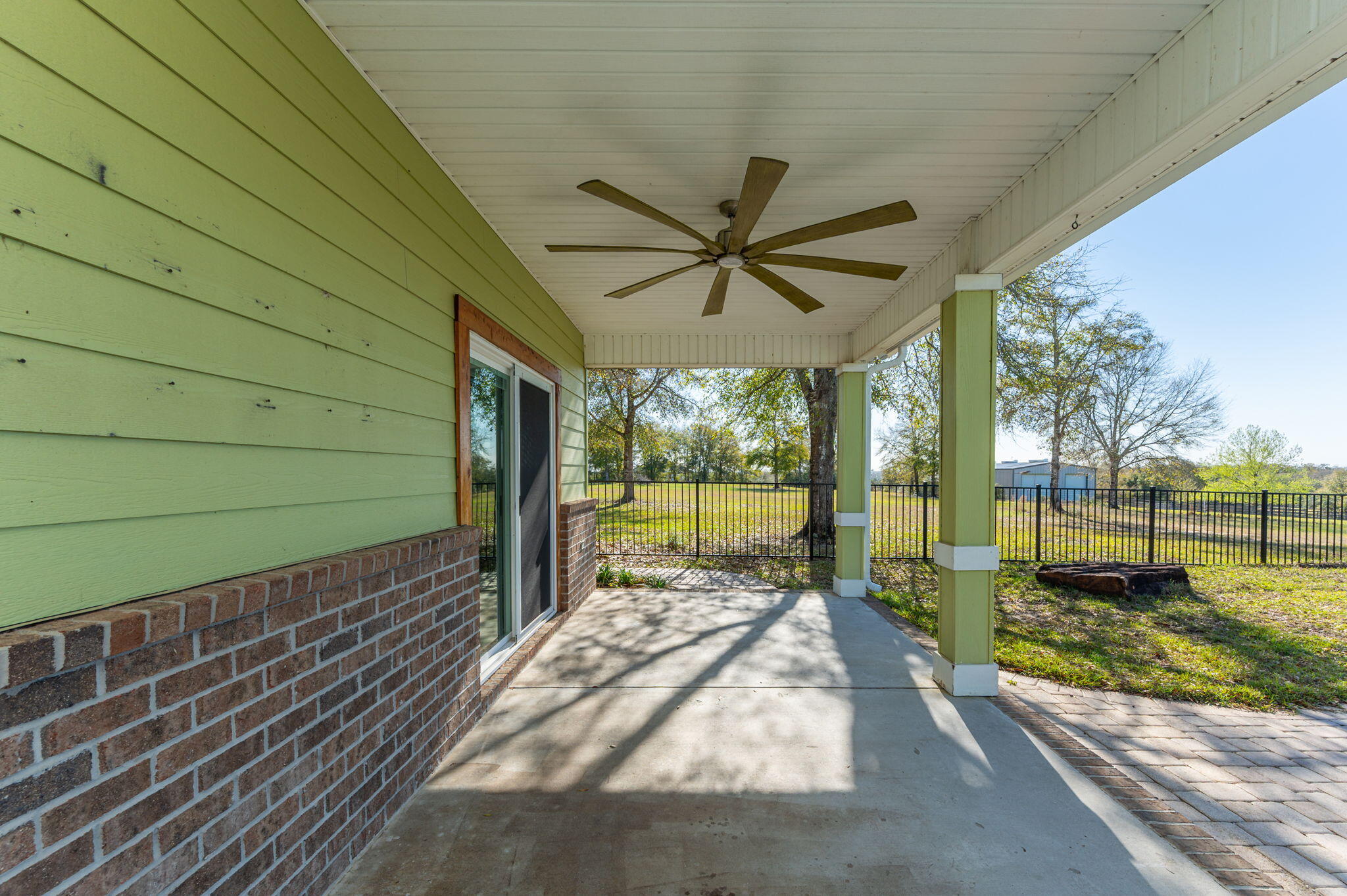 5026 Leitmann Road Baker, FL 32531 - Photo 35 of 65 a view of a porch with wooden floor