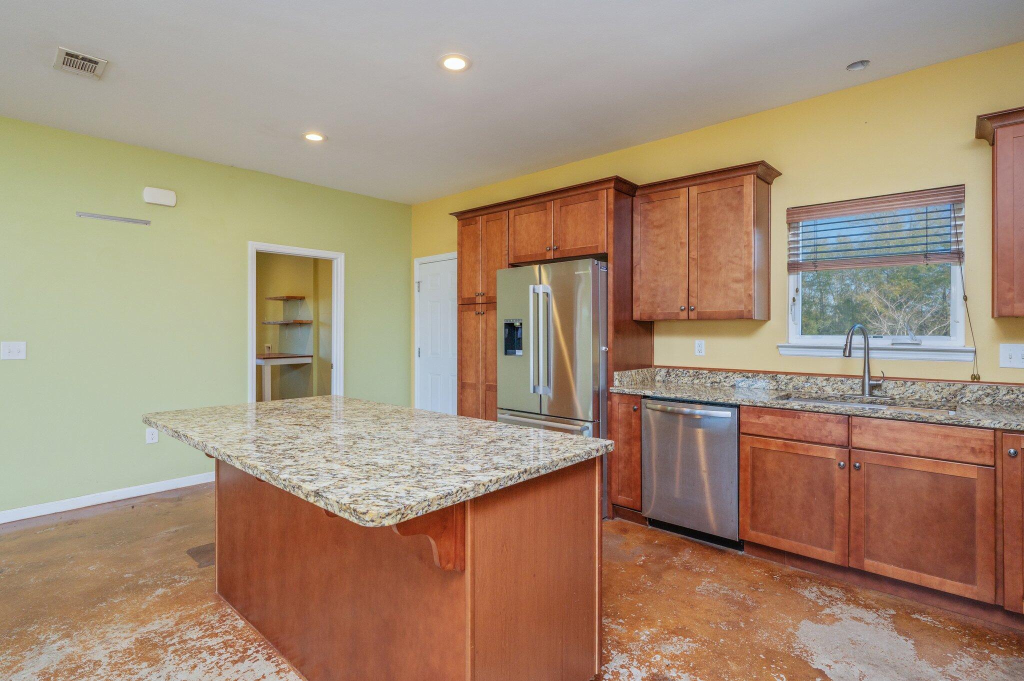 5026 Leitmann Road Baker, FL 32531 - Photo 8 of 65 a kitchen with stainless steel appliances granite countertop refrigerator sink and cabinets
