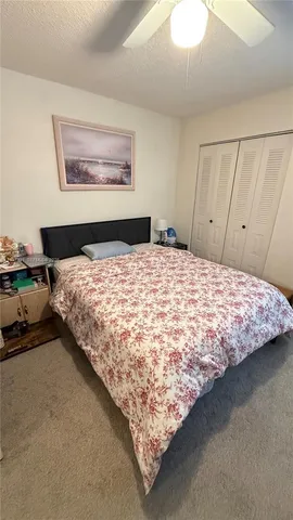 a bedroom with a bed and dresser