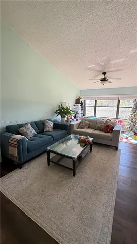 a living room with furniture and a rug