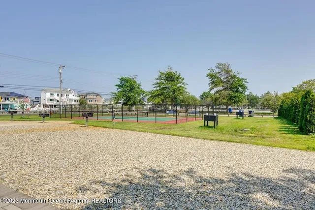 a view of swimming pool with outdoor seating and yard