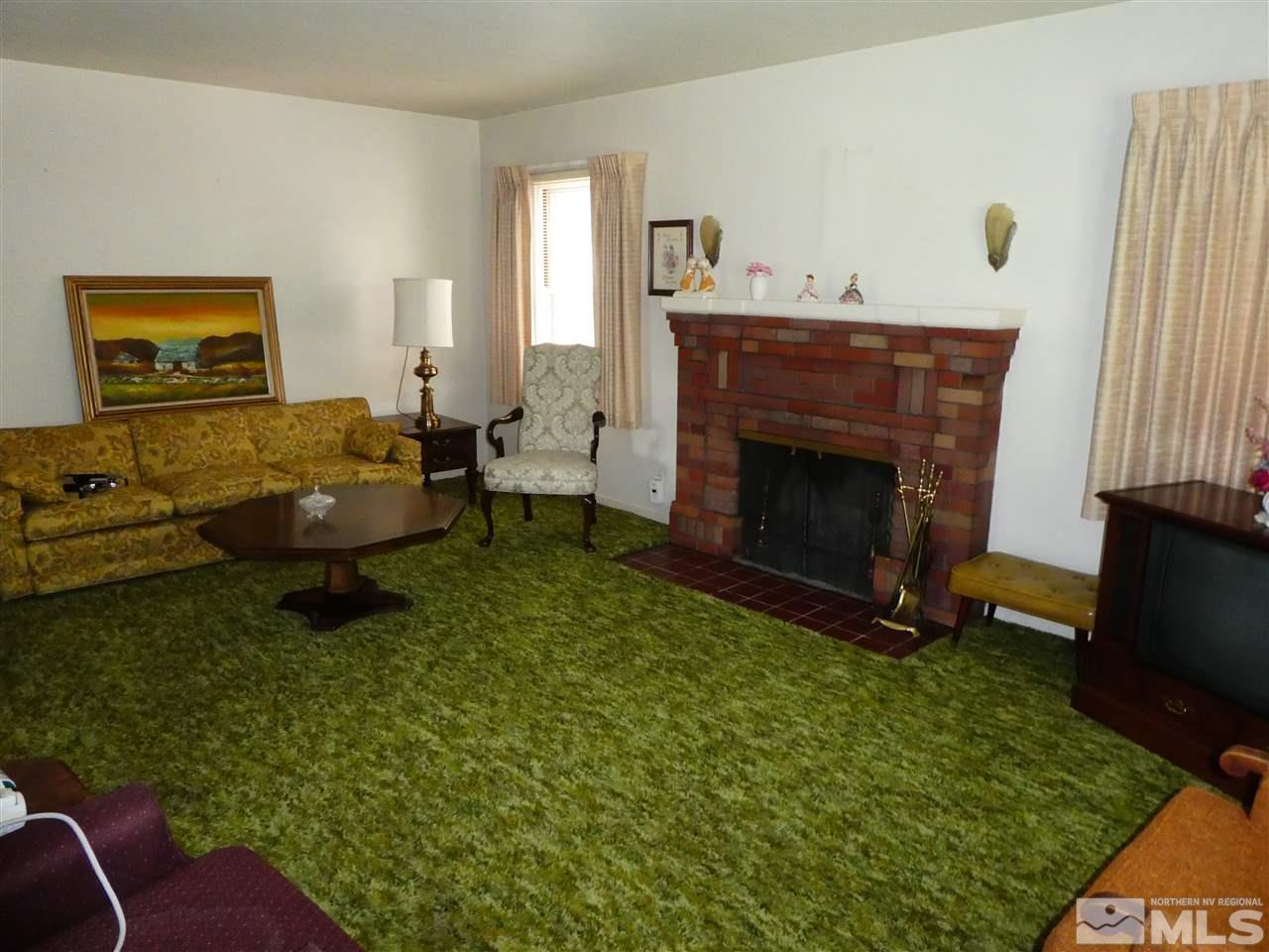 908 Gordon Avenue Reno, NV 89509 - Photo 4 of 12 a living room with furniture and a fireplace