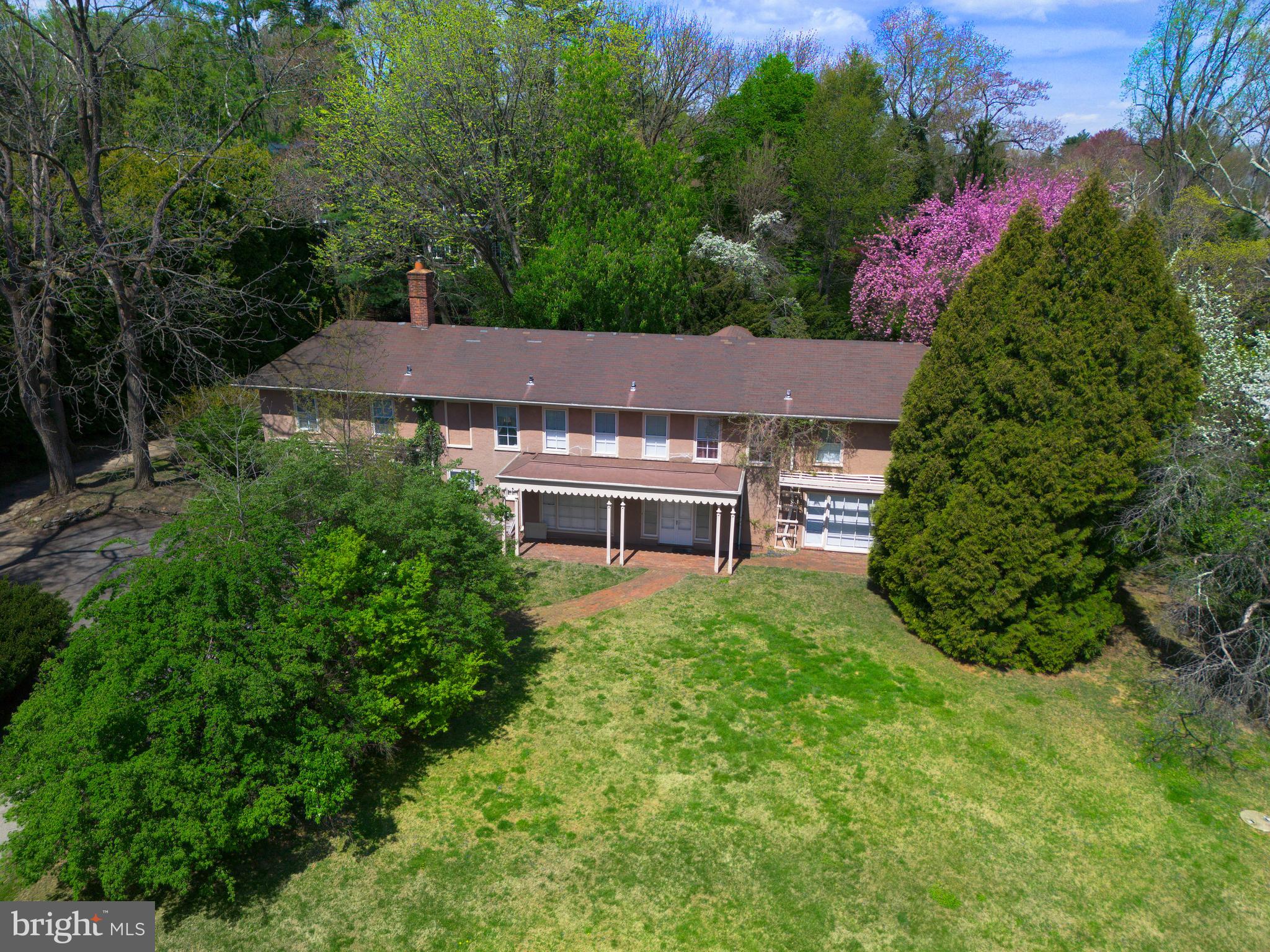 1114 Brynlawn Road Villanova, PA 19085 - Photo 3 of 24 an aerial view of a house with yard and outdoor seating