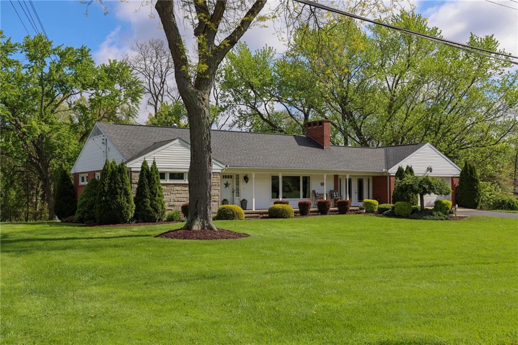 3689 Ridgewood Drive Hermitage, PA 16148 - Photo 1 of 49 a front view of a house with garden and trees