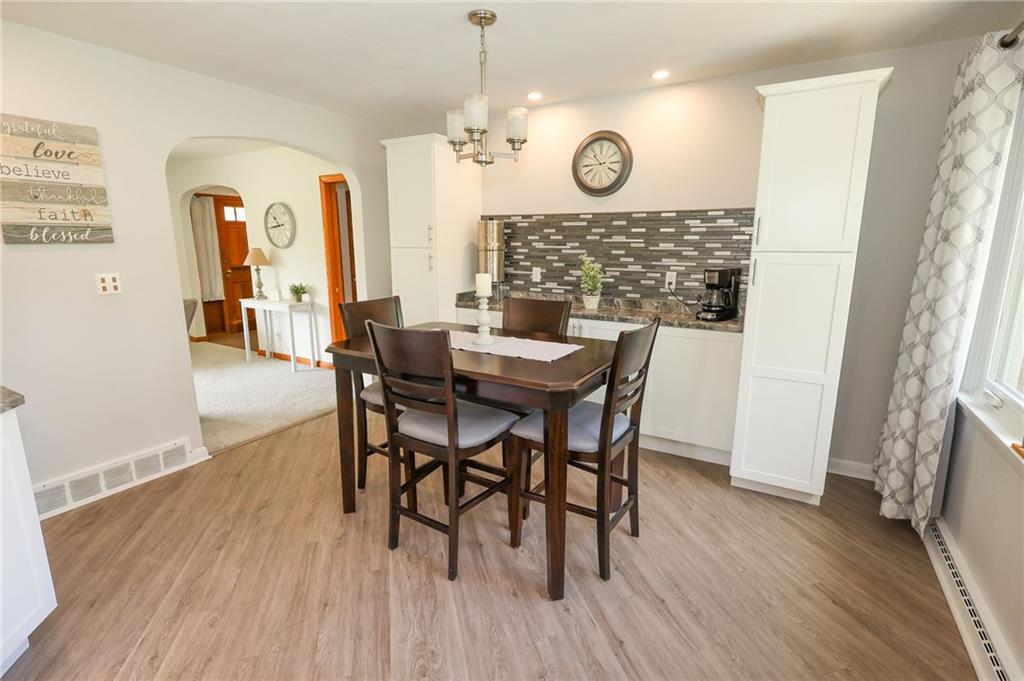 3689 Ridgewood Drive Hermitage, PA 16148 - Photo 12 of 49 a view of a dining room with furniture and wooden floor