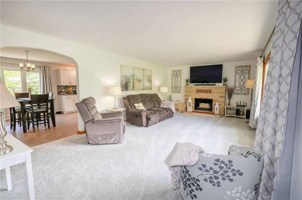 3689 Ridgewood Drive Hermitage, PA 16148 - Photo 13 of 49 a living room with furniture and a flat screen tv