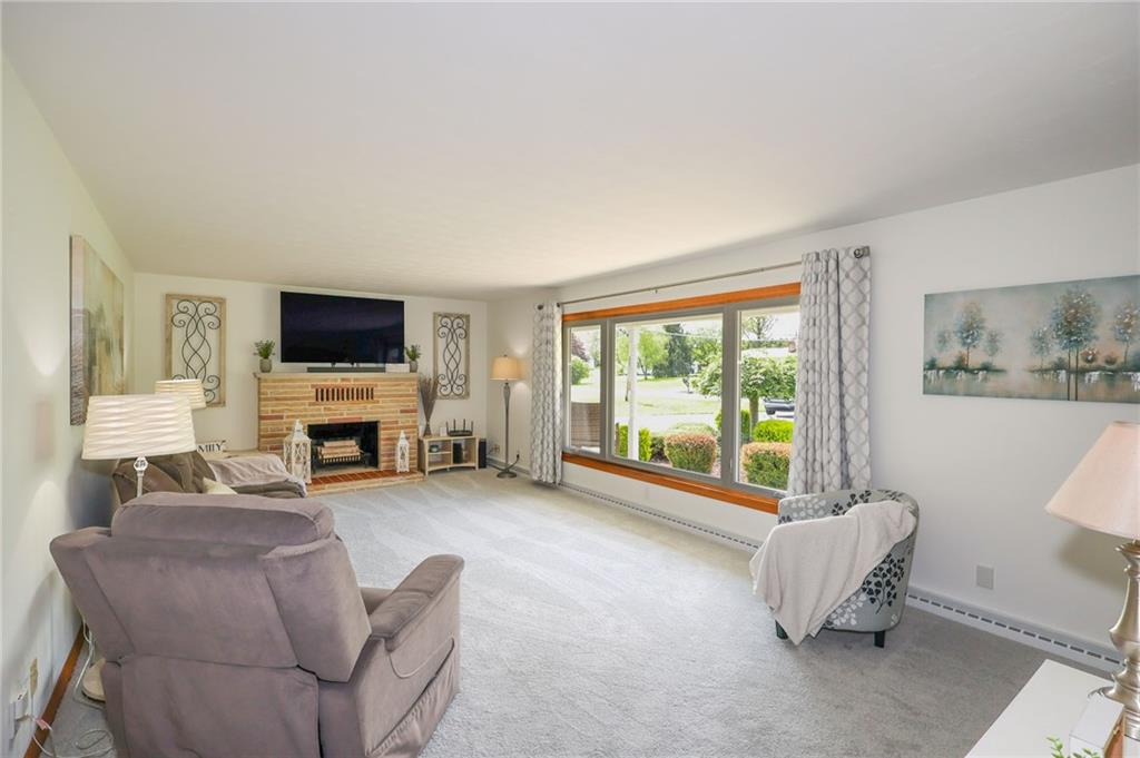 3689 Ridgewood Drive Hermitage, PA 16148 - Photo 14 of 49 a living room with furniture and a flat screen tv