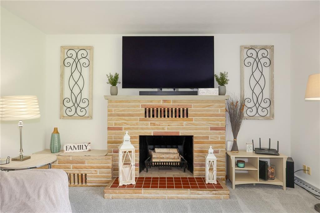 3689 Ridgewood Drive Hermitage, PA 16148 - Photo 16 of 49 a living room with furniture and a flat screen tv