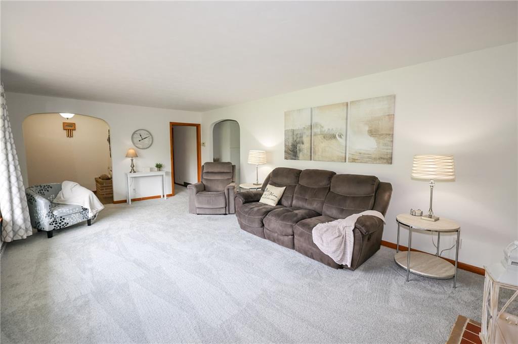 3689 Ridgewood Drive Hermitage, PA 16148 - Photo 17 of 49 a living room with furniture and a lamp