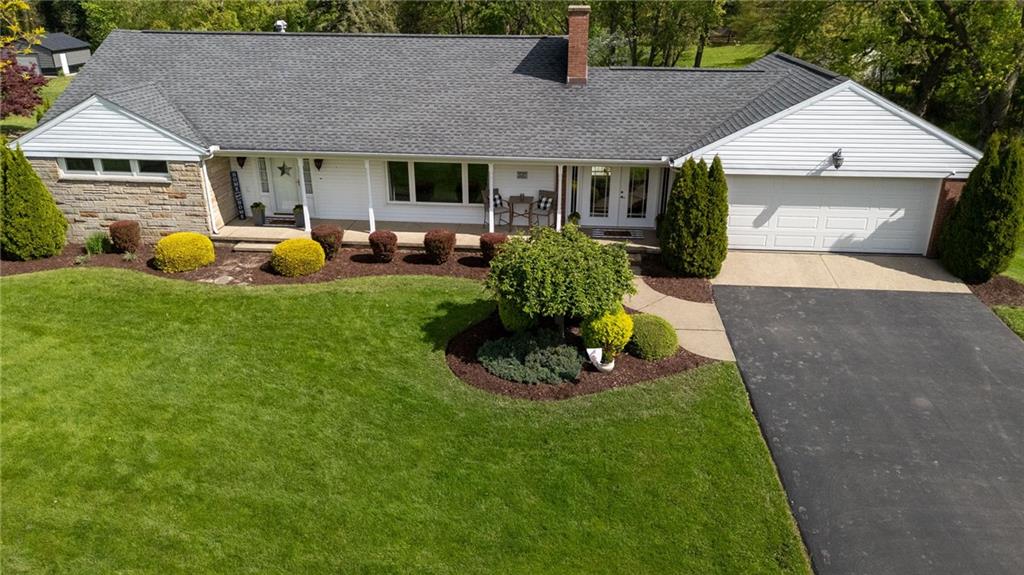 3689 Ridgewood Drive Hermitage, PA 16148 - Photo 2 of 49 a front view of a house with garden
