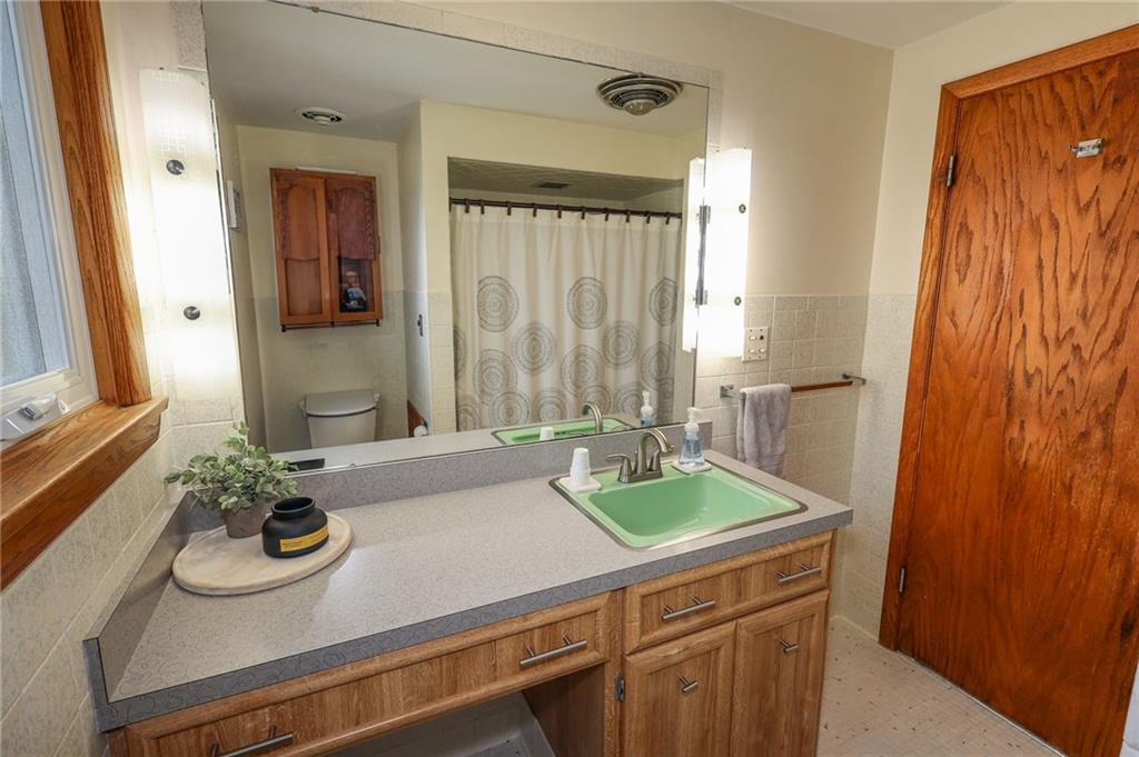3689 Ridgewood Drive Hermitage, PA 16148 - Photo 23 of 49 a bath room with sink and a mirror