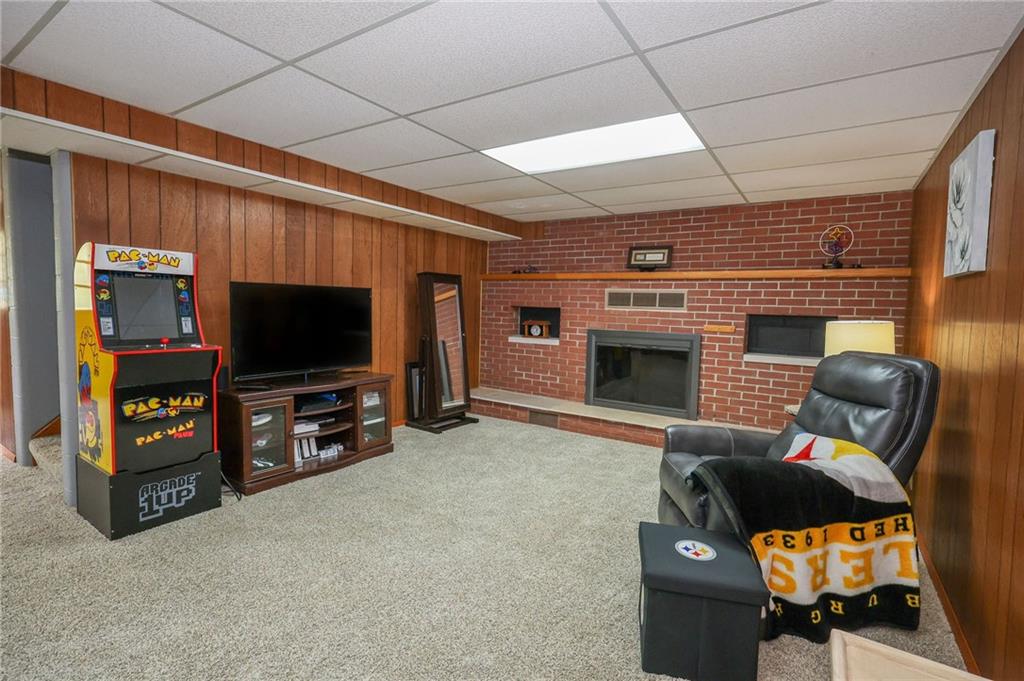 3689 Ridgewood Drive Hermitage, PA 16148 - Photo 26 of 49 a living room with furniture and a flat screen tv