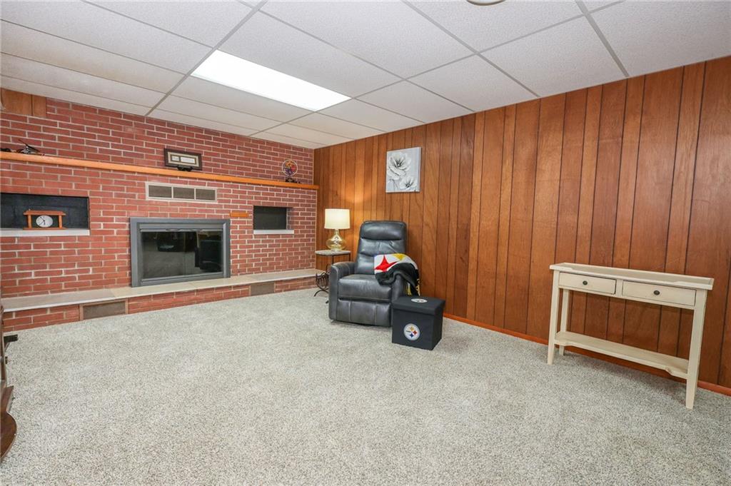 3689 Ridgewood Drive Hermitage, PA 16148 - Photo 27 of 49 a living room with furniture and a fireplace