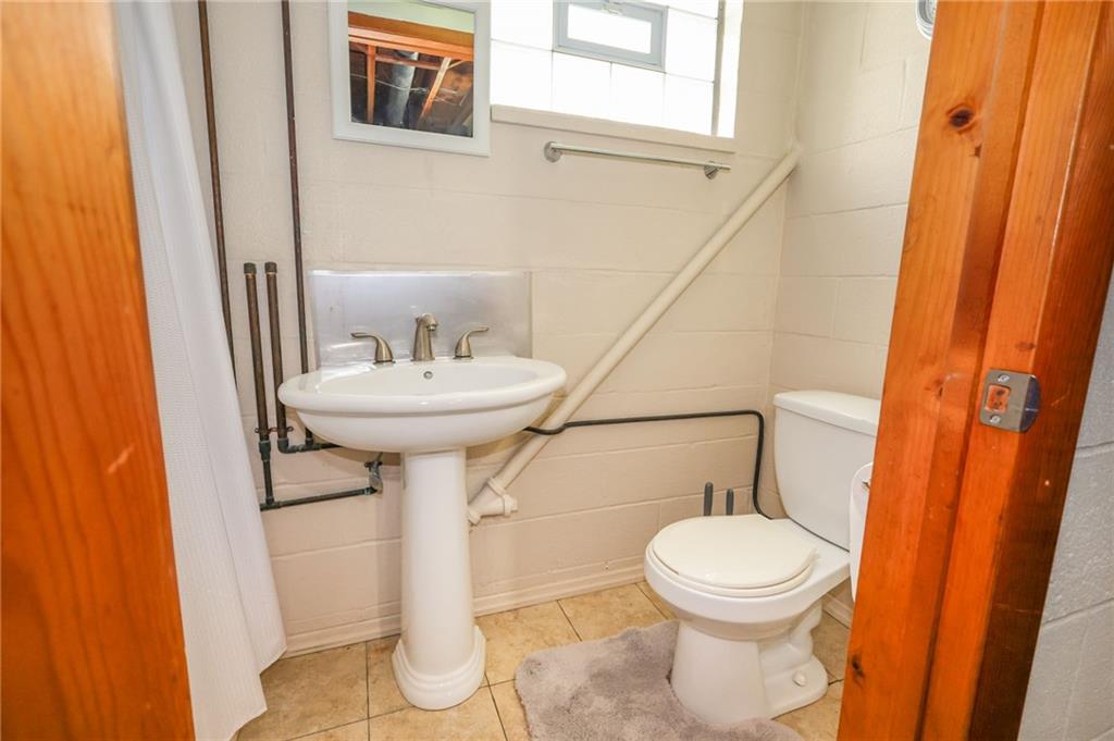 3689 Ridgewood Drive Hermitage, PA 16148 - Photo 31 of 49 a bathroom with a sink toilet and a mirror