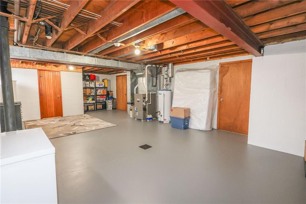 3689 Ridgewood Drive Hermitage, PA 16148 - Photo 35 of 49 a view of an empty room with wooden floor and a window