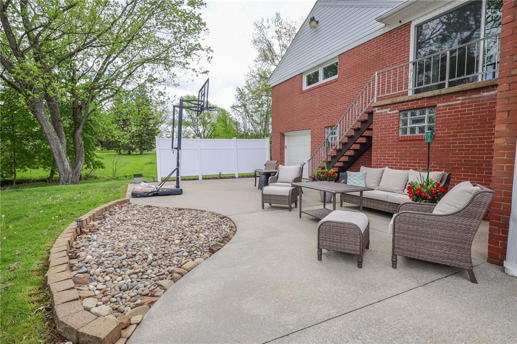 3689 Ridgewood Drive Hermitage, PA 16148 - Photo 37 of 49 a view of a patio with couches chairs and a big yard