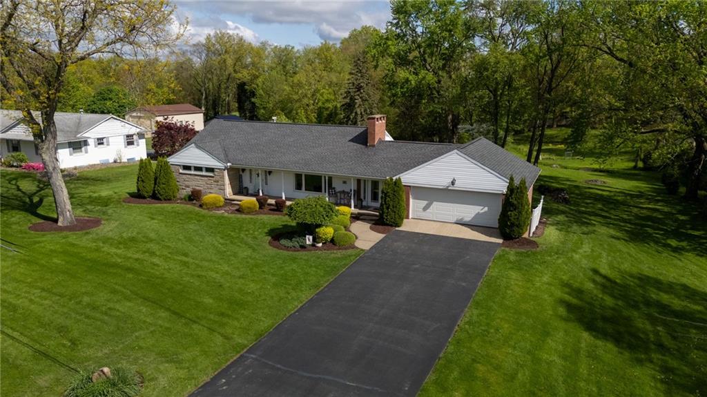 3689 Ridgewood Drive Hermitage, PA 16148 - Photo 48 of 49 a aerial view of a house with a yard table and chairs