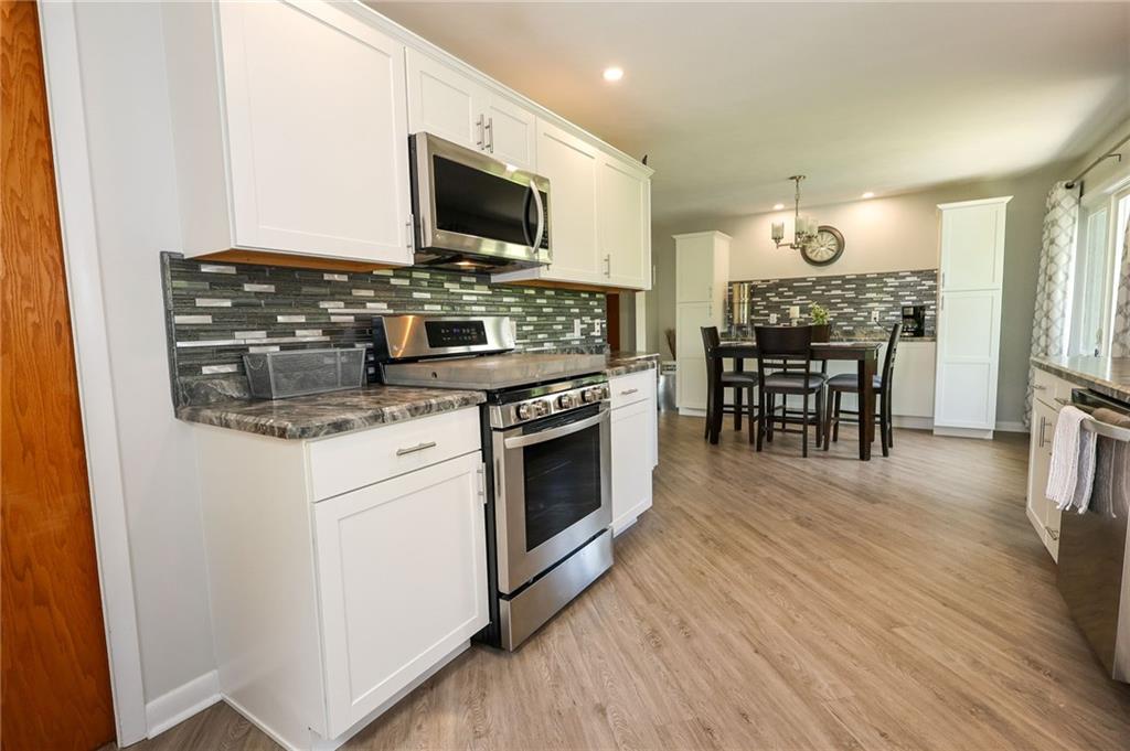 3689 Ridgewood Drive Hermitage, PA 16148 - Photo 10 of 49 a kitchen with a stove and a microwave