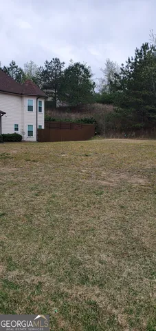 a view of house with outdoor space