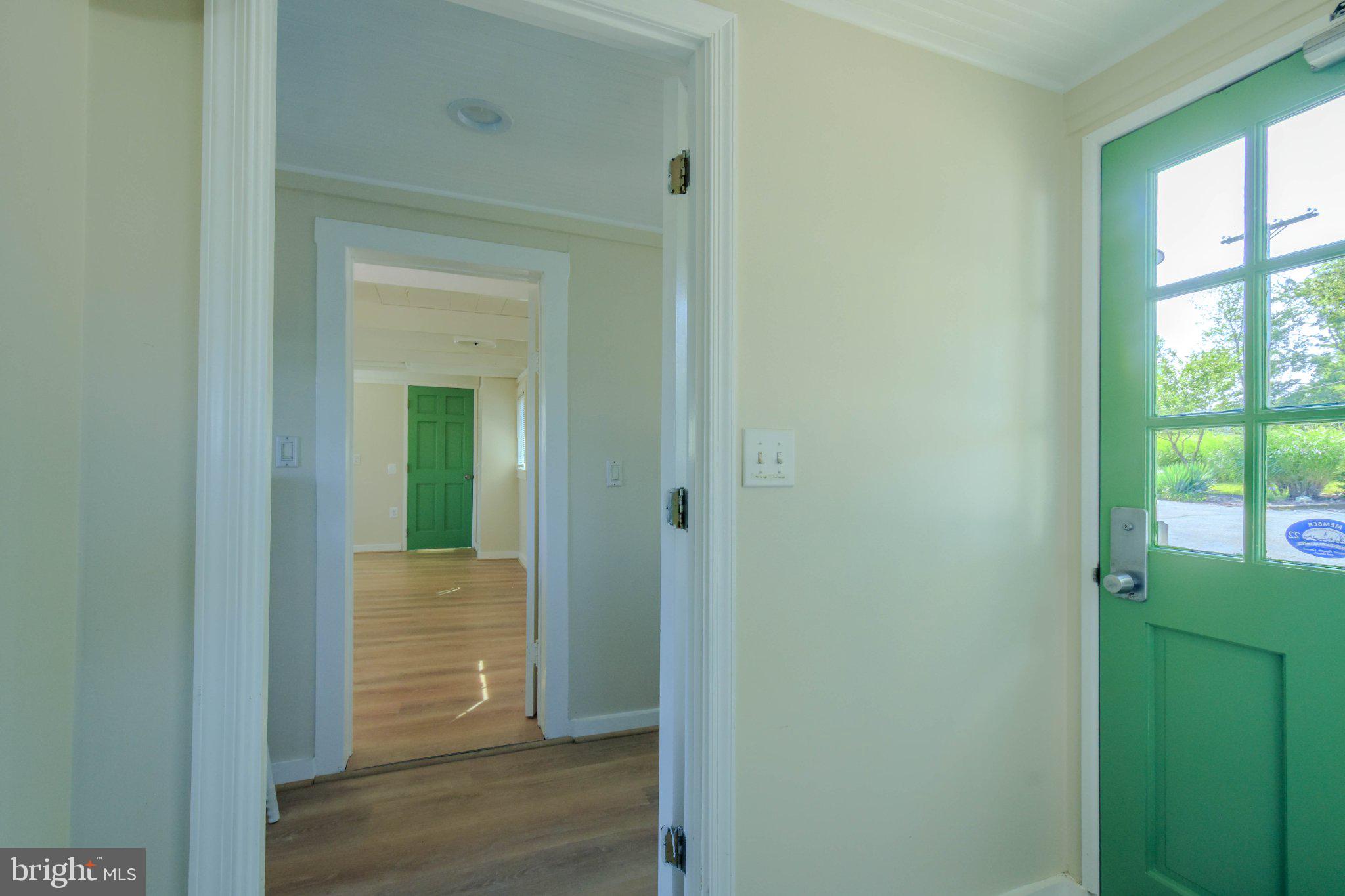 6062 Drum Point Road Deale, MD 20751 - Photo 2 of 17 Inviting entry with vibrant green door.