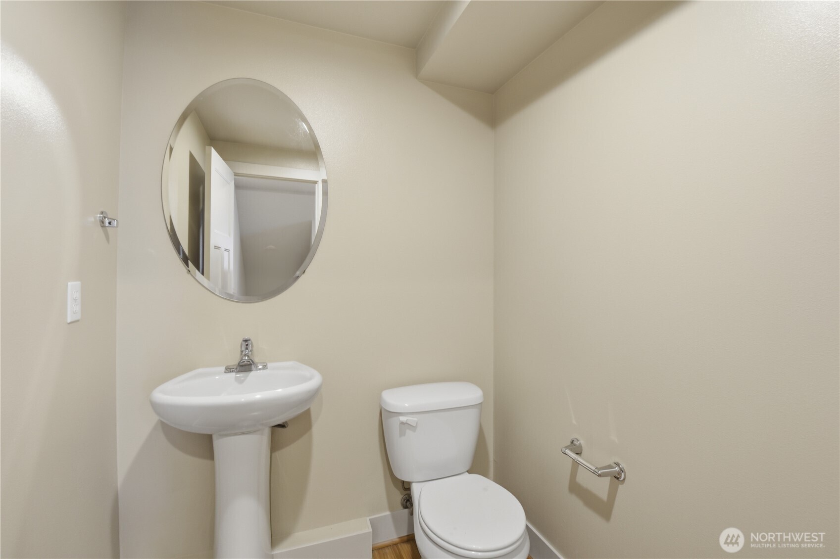 723 North 95th Street, Unit A Seattle, WA 98103 - Photo 7 of 20 a bathroom with a toilet sink and mirror