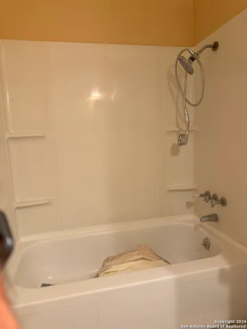 a bathroom with a bathtub