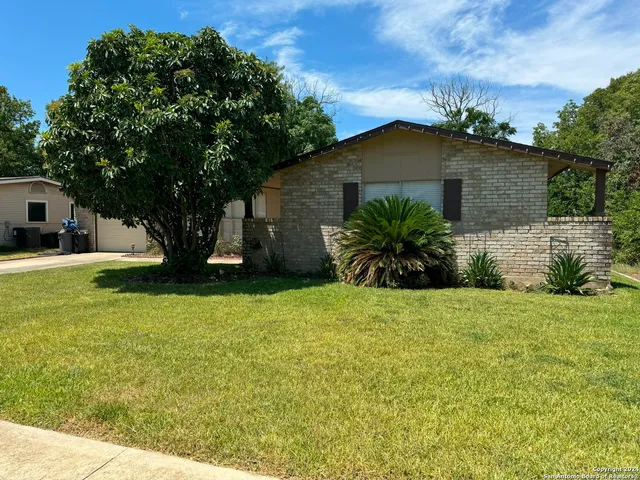 a house with swimming pool in front of it