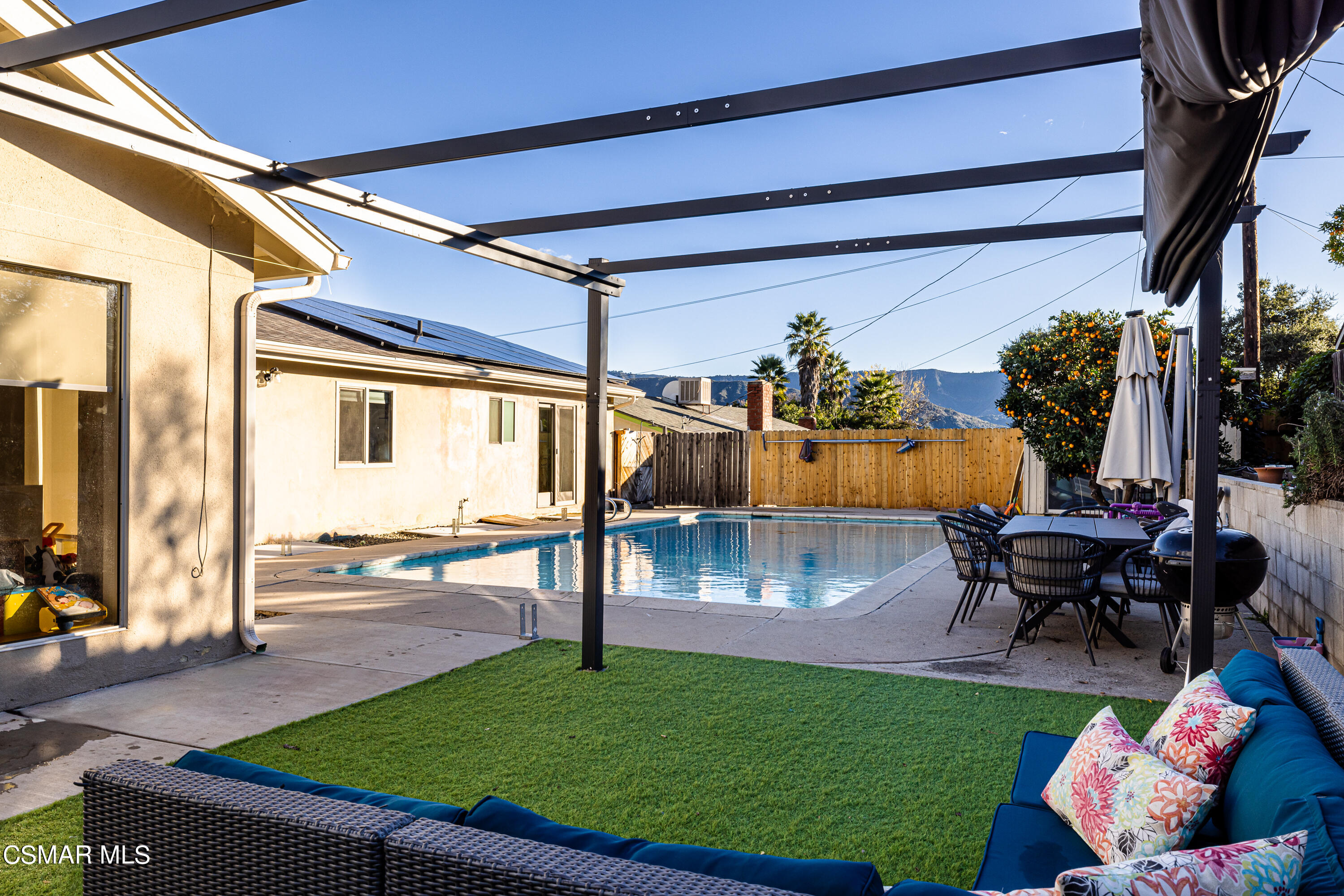 1405 Meadowbrook Road Ojai, CA 93023 - Photo 25 of 25 a view of a backyard with couches table and chairs and potted plants