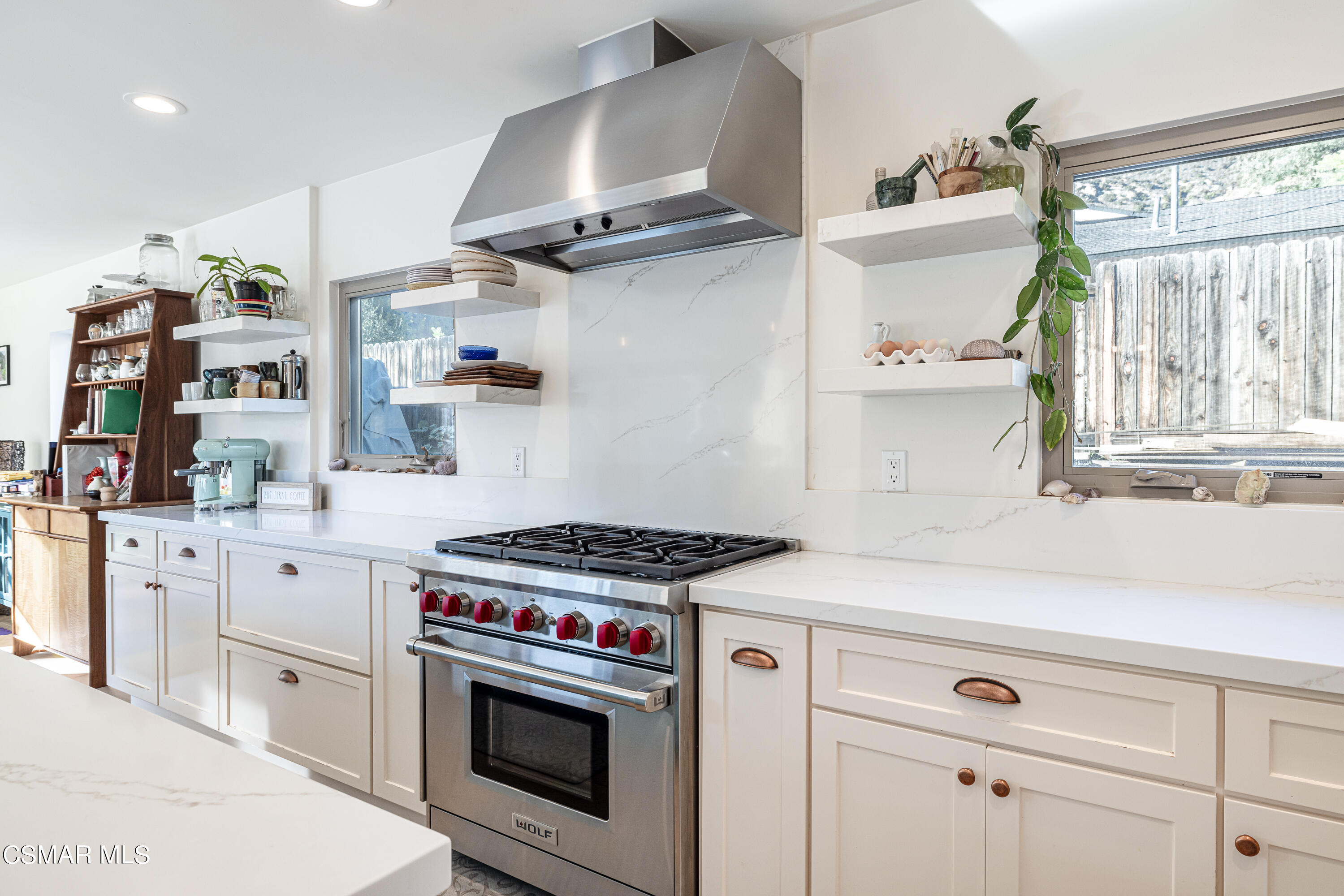 1405 Meadowbrook Road Ojai, CA 93023 - Photo 10 of 25 a kitchen with cabinets a stove and a wooden floor