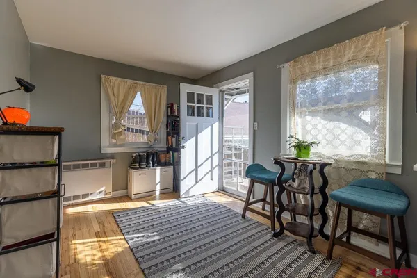 a kitchen with a refrigerator and windows