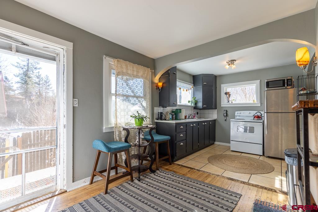 3533 Main Avenue Durango, CO 81301 - Photo 9 of 19 a kitchen with a refrigerator and windows