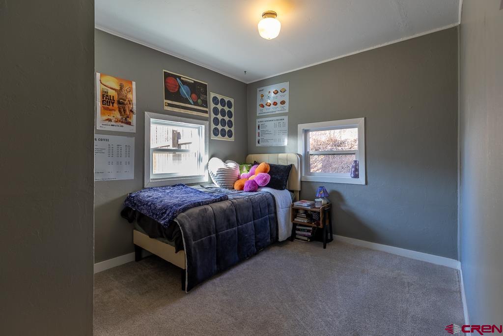 3533 Main Avenue Durango, CO 81301 - Photo 14 of 19 a living room with a bed furniture and a window