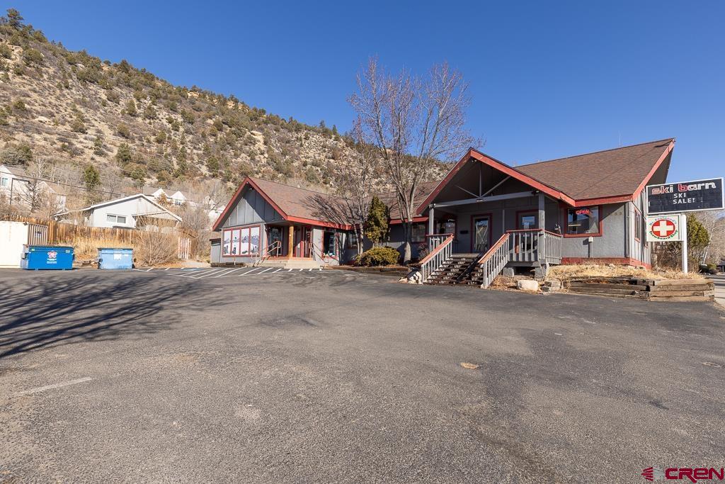 3533 Main Avenue Durango, CO 81301 - Photo 2 of 19 a view of a house with large windows and a road