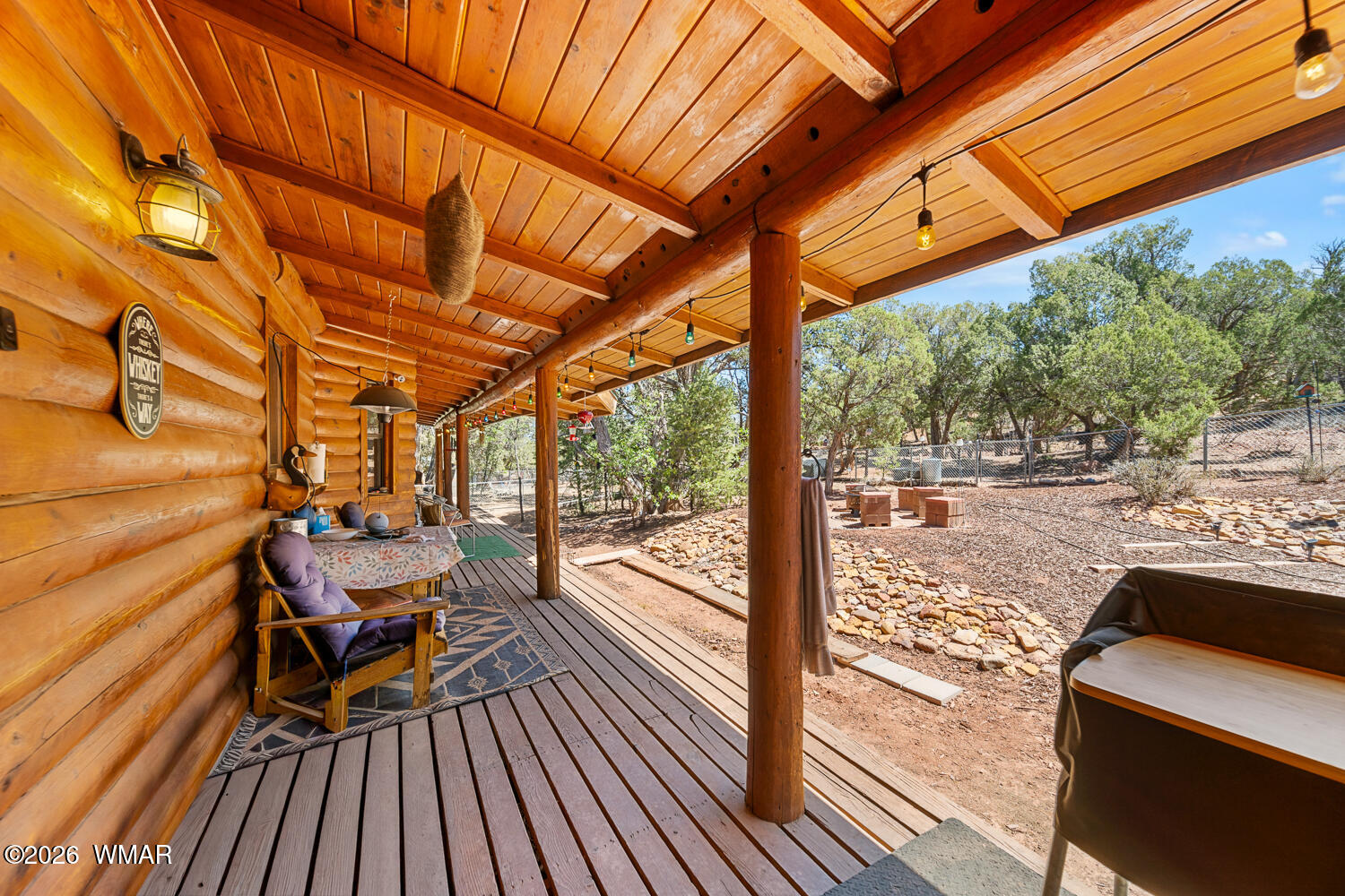 6720 Cheney Ranch Loop Show Low, AZ 85901 - Photo 11 of 55 a view of a balcony with chairs and wooden floor
