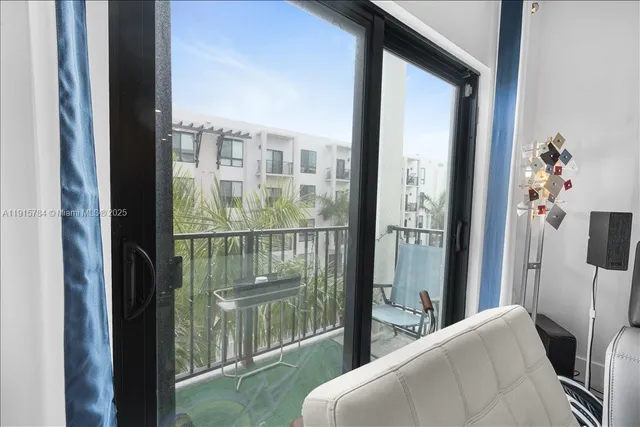 a view of a workspace with furniture and wooden floor