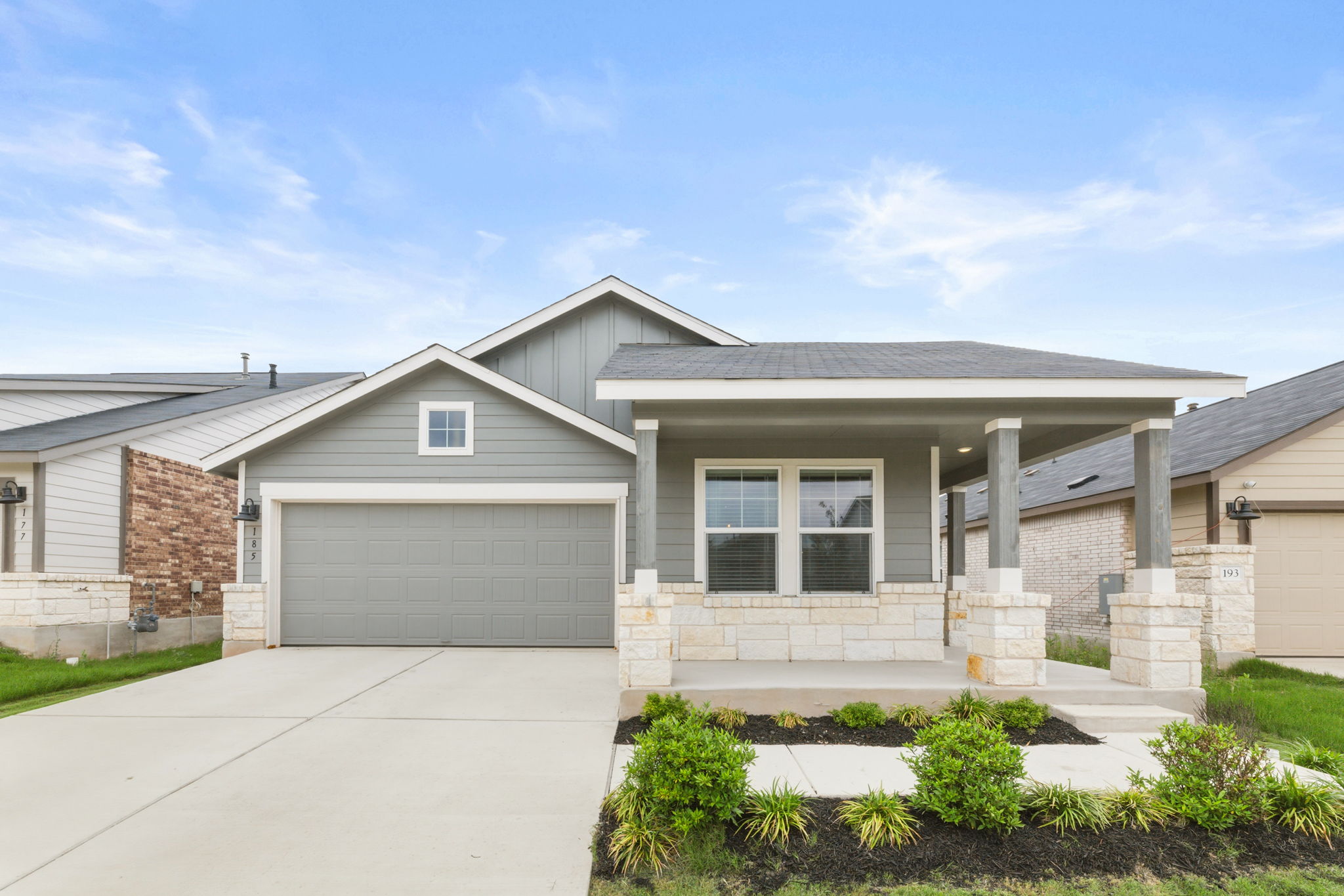185 Sormonne Loop Kyle, TX 78640 - Photo 2 of 40 front view of a house with a yard