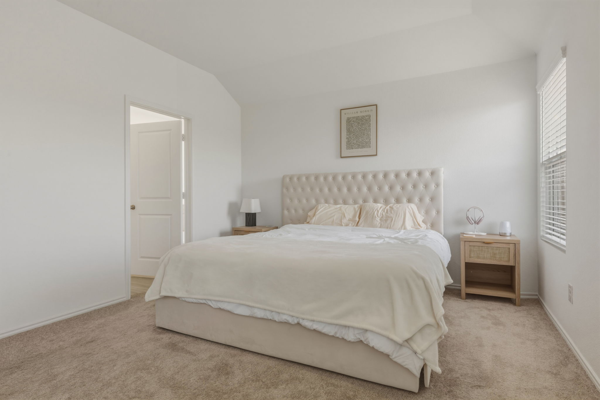 185 Sormonne Loop Kyle, TX 78640 - Photo 21 of 40 a bedroom with a bed and a lamp