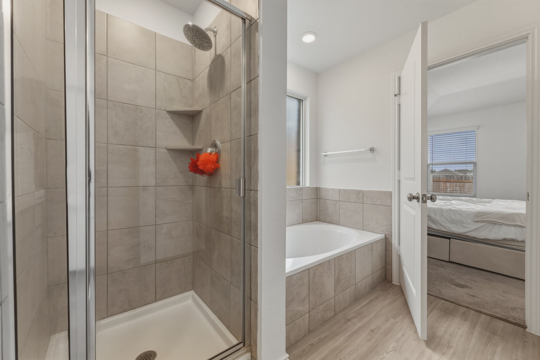 185 Sormonne Loop Kyle, TX 78640 - Photo 25 of 40 a bathroom with a bathtub and a shower