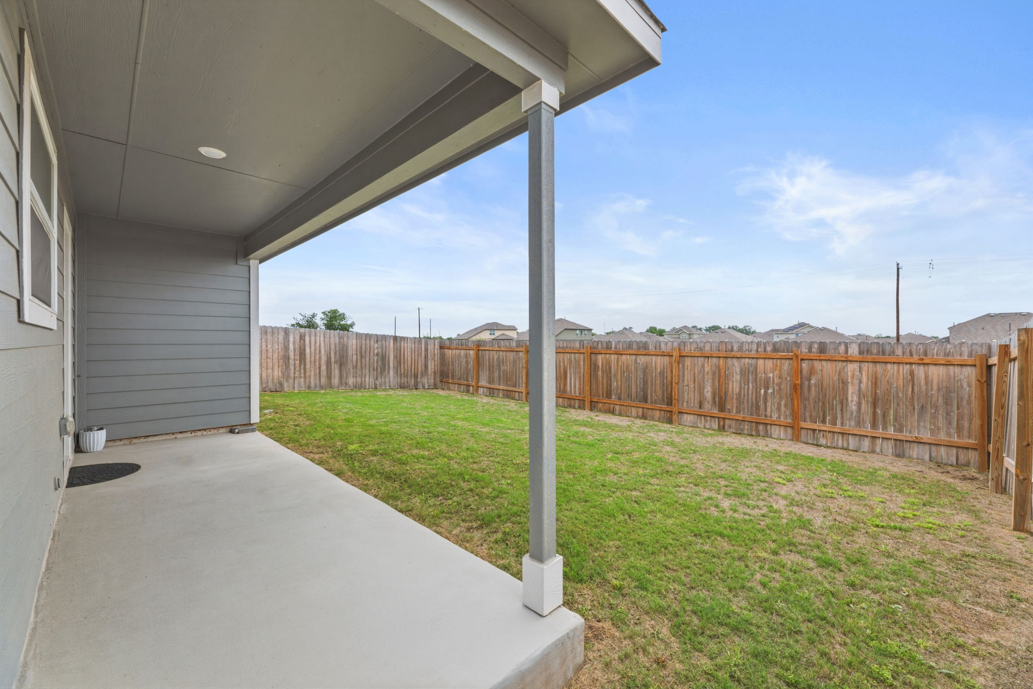 185 Sormonne Loop Kyle, TX 78640 - Photo 35 of 40 a view of a backyard with a garden