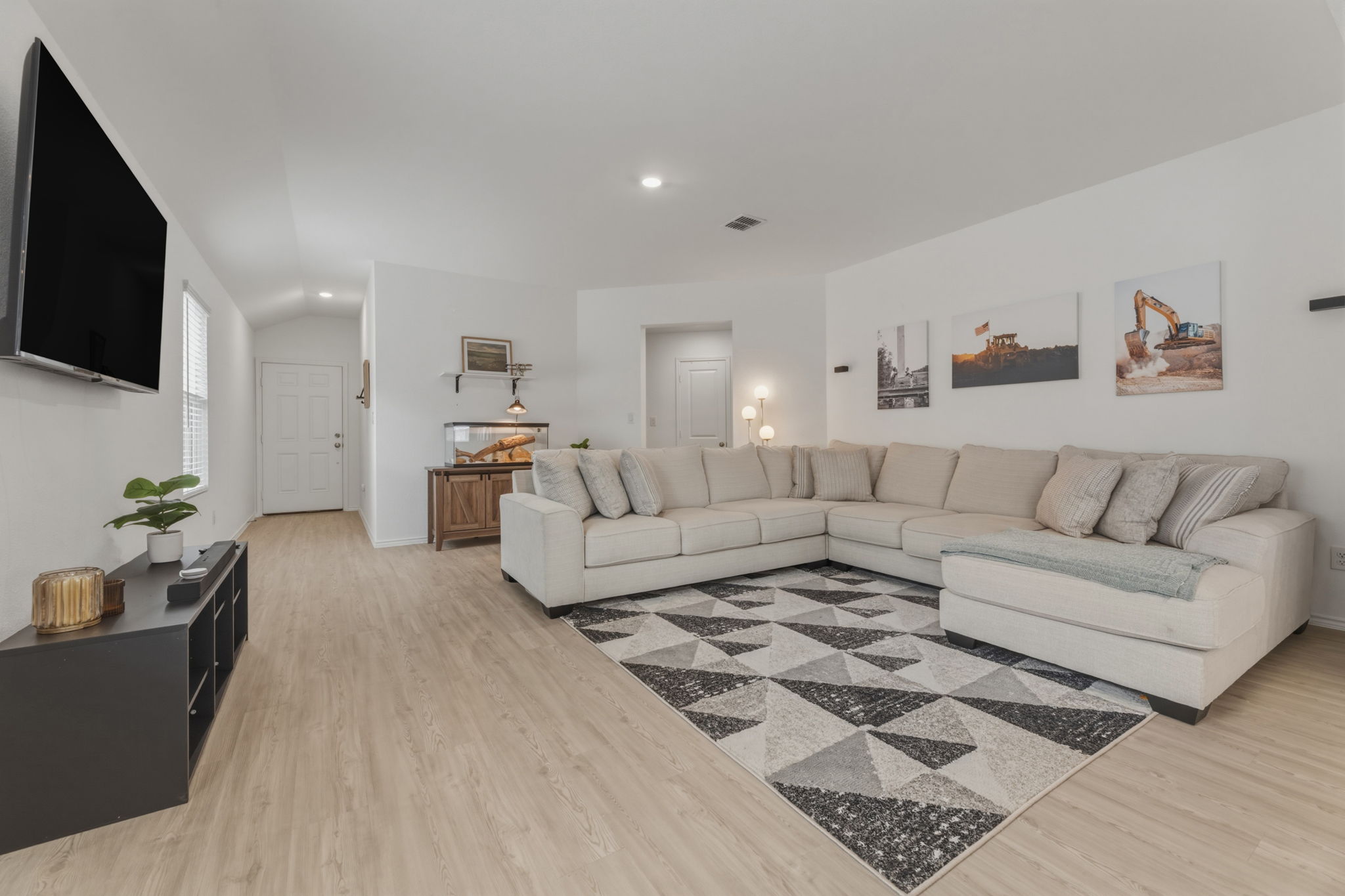 185 Sormonne Loop Kyle, TX 78640 - Photo 6 of 40 a living room with furniture and a flat screen tv