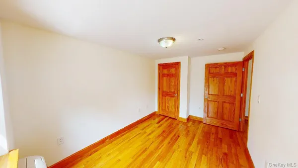 a view of a room with wooden floor and small space