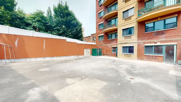 a view of building with tree in front of it
