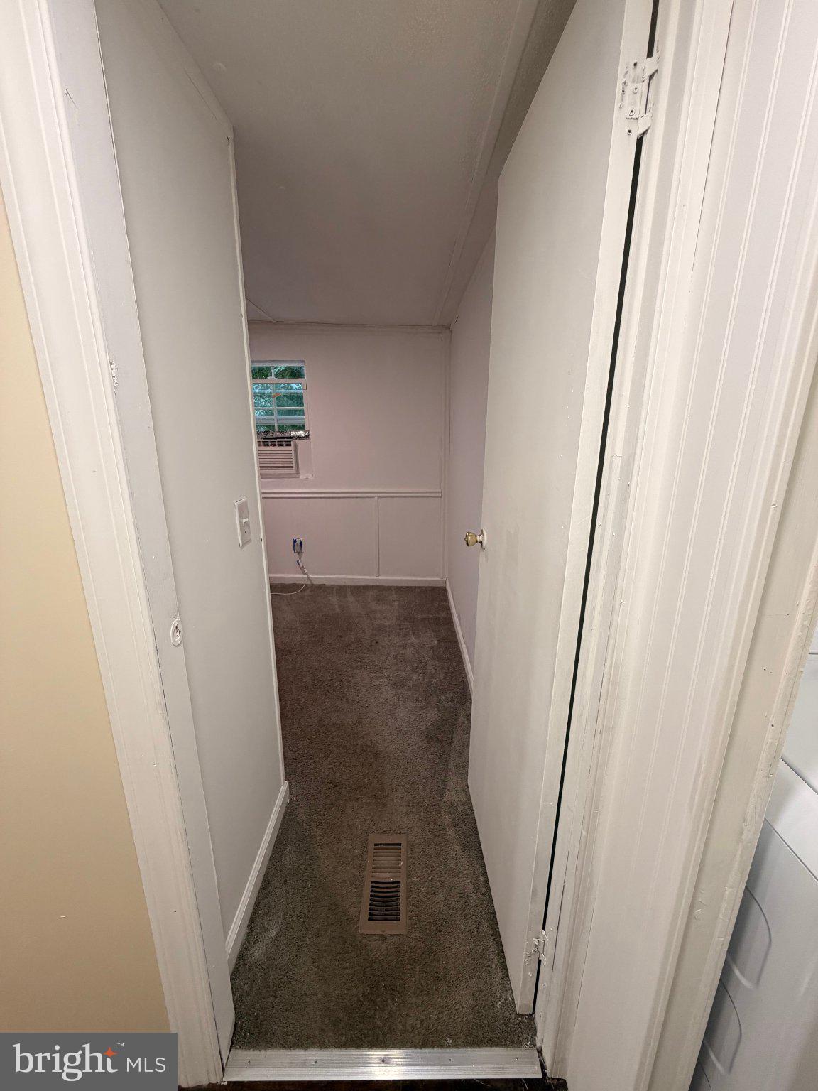 24 Carpenter Street, Unit 24 Dover, DE 19901 - Photo 13 of 27 Inviting hallway with natural light.