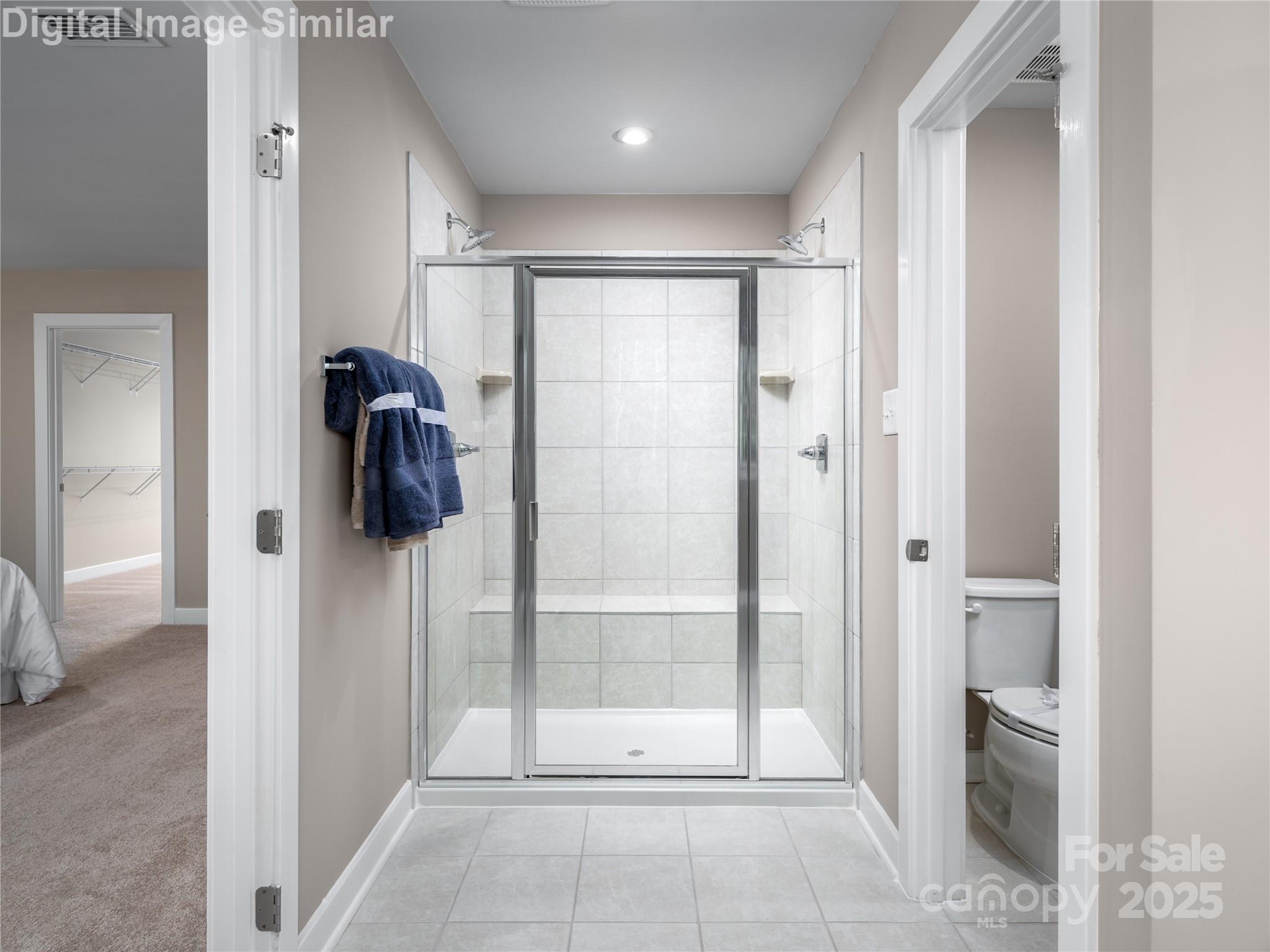 7538 West Berkeley Road Denver, NC 28037 - Photo 12 of 33 a bathroom with a shower and a glass door