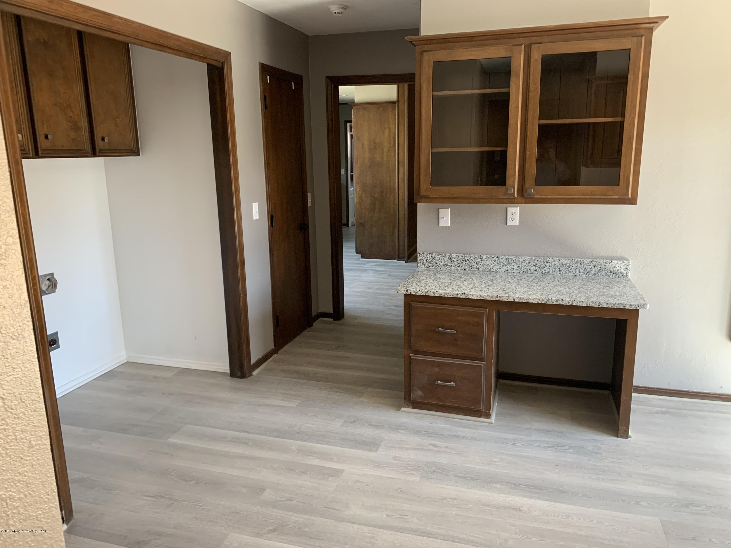 6905 Dreyfuss Road Amarillo, TX 79106 - Photo 18 of 19 a room with a cabinets and a window