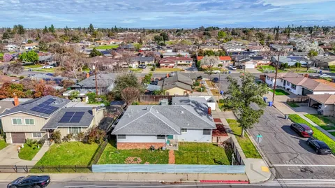 an aerial view of a house with a garden