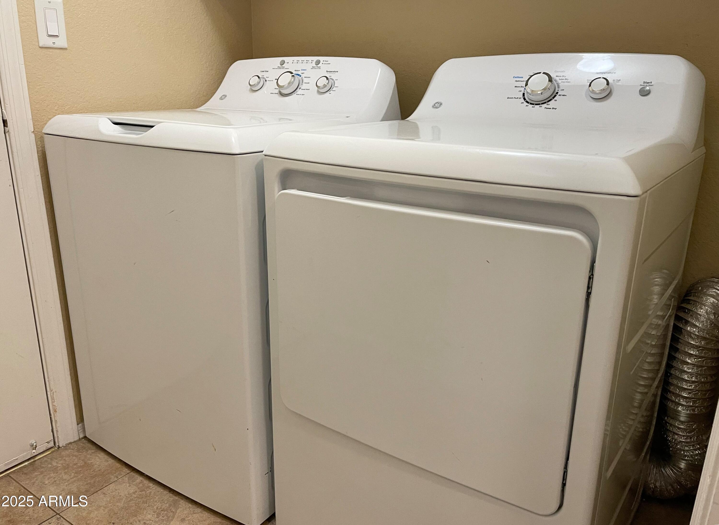 6926 West Via Del Sol Drive Glendale, AZ 85310 - Photo 16 of 18 a utility room with dryer and washer