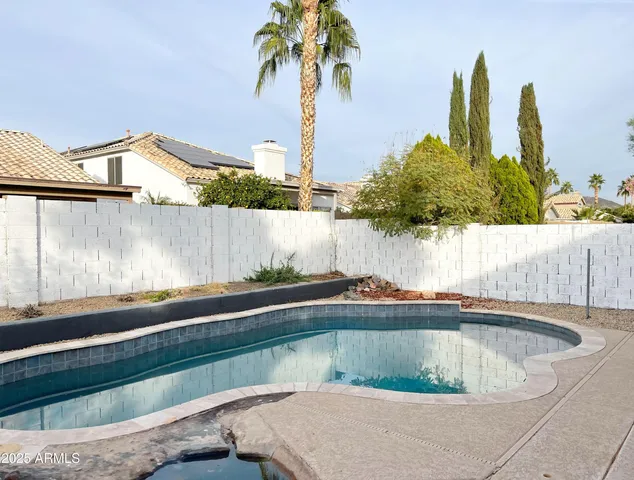 a view of outdoor space and swimming pool